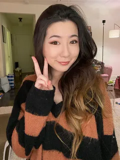 fuslie (streamer) - orange & black striped jumper