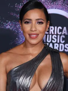 julissa bermúdez braless boobs showing nice cleavage in a revealing dress on the red carpet at the american music awards.