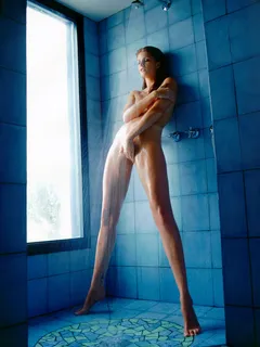 long legged redhead touching herself in the shower.