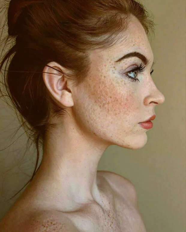 skinny redhead with freckles in profile