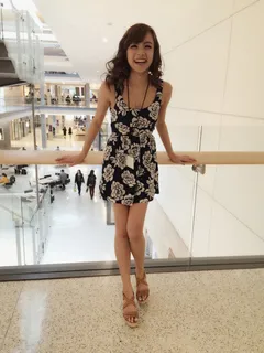 beautiful filipina spinner wearing high heels at a manila philippines mall