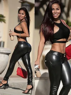 dolly castro in a crop top and leather pants