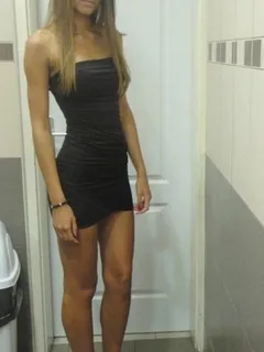 hot blonde in a short black dress