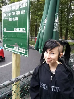 paraquat suicide makes a sexy goth facial expression while right outside by the go carts with awesome gothic black hair- sgb cooll gothh hff