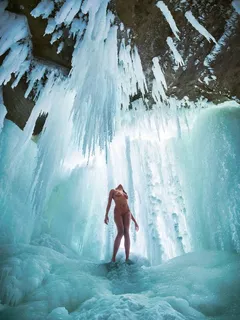 naked in a frozen waterfall