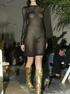 nicole trunfio essentially naked with see-through dress at a fashion show.