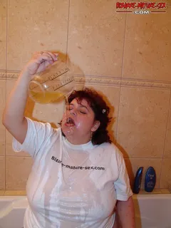 fat granny pours her own morning piss in her mouth.