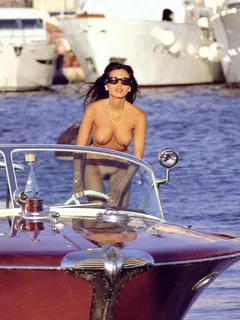 another pretty lady driving the boat naked.