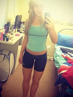 sexy blonde taking a selfshot showing off her sexy gap and legs in tight spandex