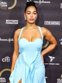 jorja smith big boobs showing nice cleavage in a sexy blue dress photographed on the red carpet.