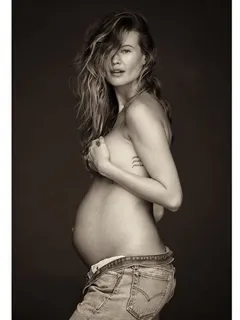 behati prinsloo goes topless, shows off her bare baby bump