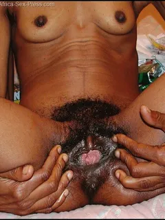 skinny african grandma with little breast open wide legs to show her bushy wet cunt and the turgid clit …