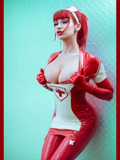 bare breasts in latex costume of a nurse